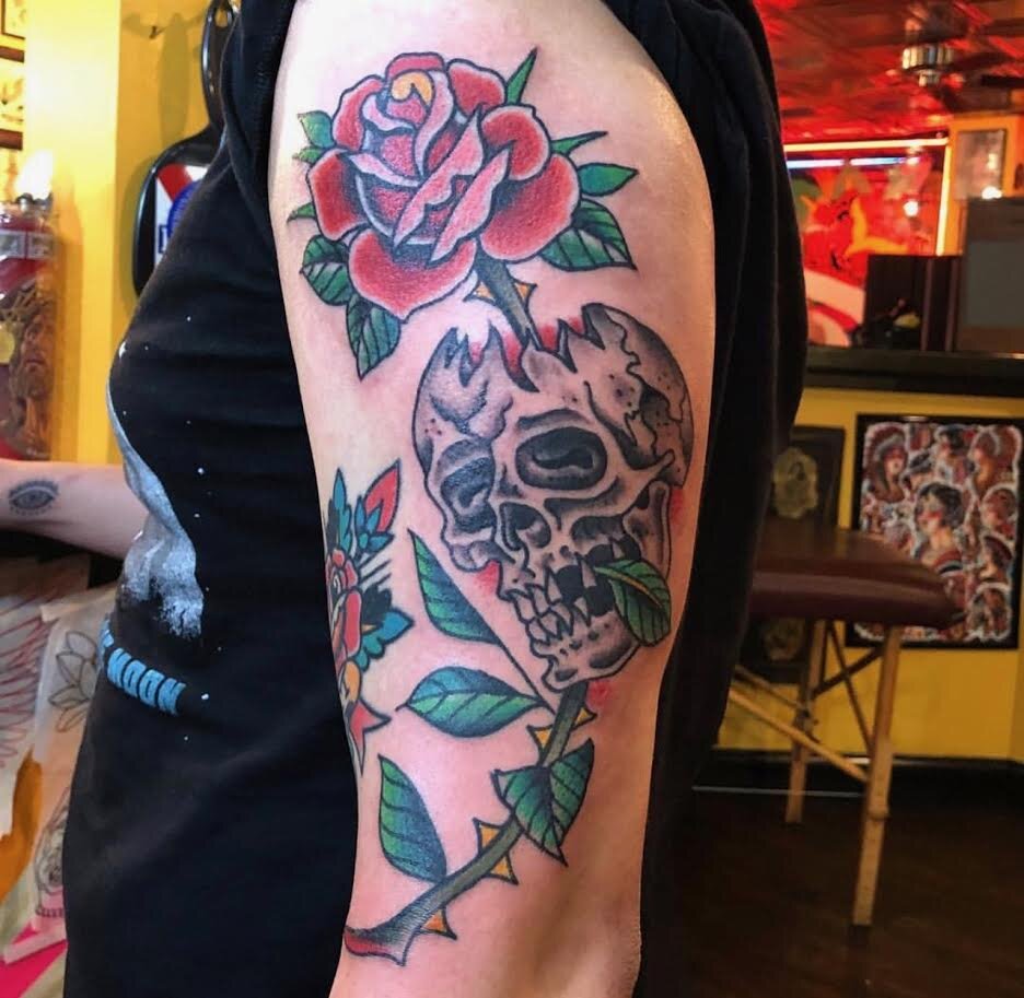 Traditional tattoo of skull and roses by Andrew Patch at Southern Star Tattoo in Atlanta, Georgia.