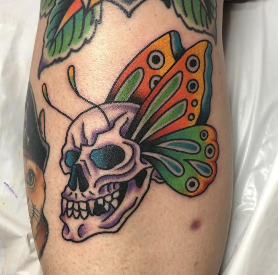 Skull and butterfly wings tattoo by Andrew Patch at Southern Star Tattoo in Atlanta, Georgia.