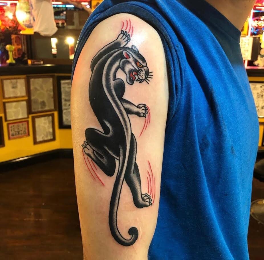 Traditional clawing panther tattoo by Andrew Patch at Southern Star Tattoo in Atlanta, Georgia.