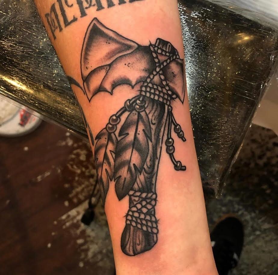 Detailed tomahawk tattoo ion black and grey by Andrew Patch at Southern Star Tattoo in Atlanta, Georgia.