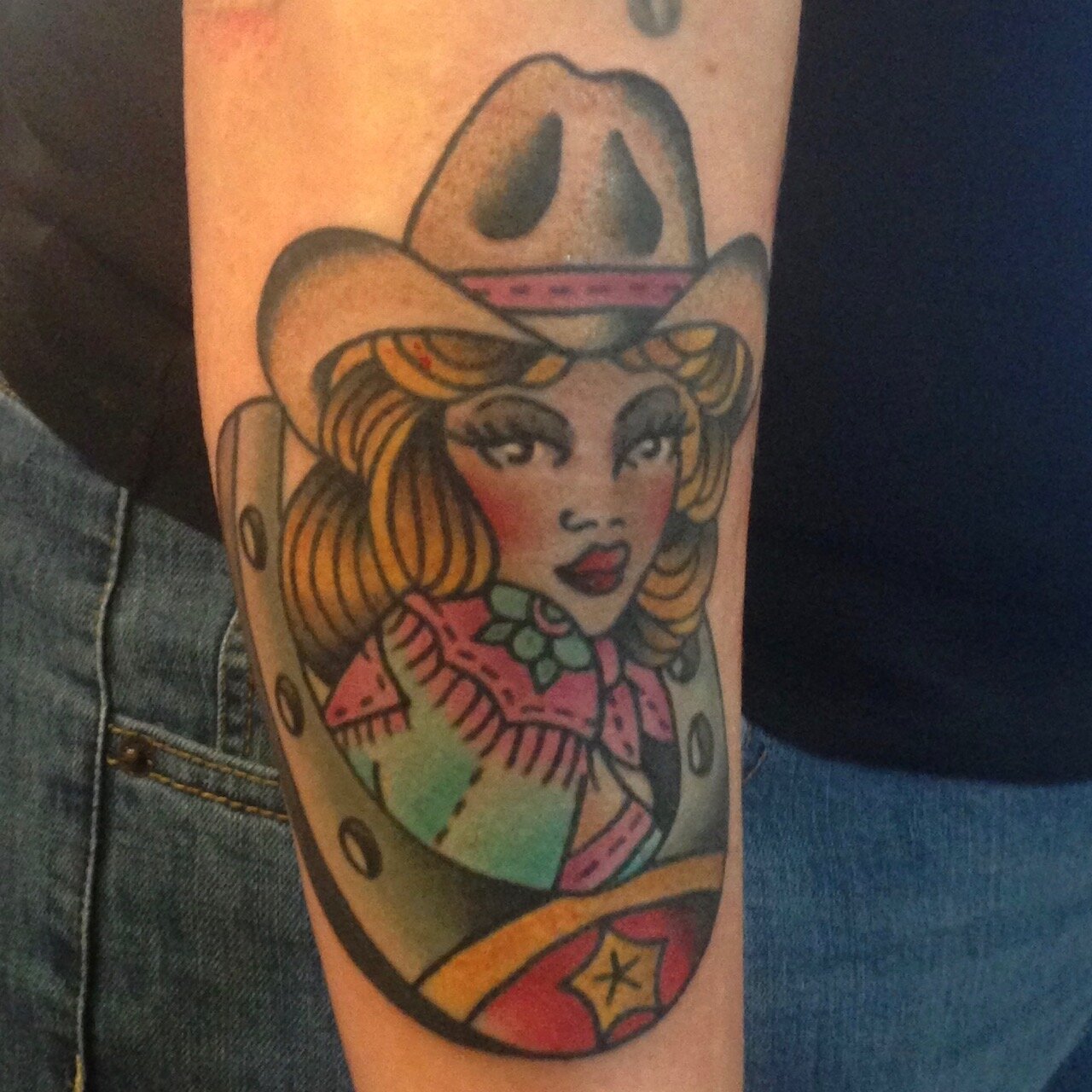 Western woman tattoo with horseshoe by Josh Hanes at Southern Star Tattoo in Atlanta, Georgia