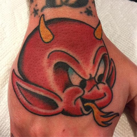 Devil tattoo on hand in bold color by Bill Conner at Southern Star Tattoo in Atlanta, Georgia