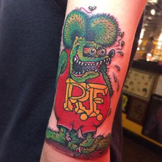RF tattoo in bold color by Demian Bouchan at Southern Star Tattoo in Atlanta, Georgia