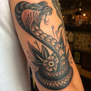 Traditional cobra tattoo in black and grey by Demian Bouchan at Southern Star Tattoo in Atlanta, Georgia