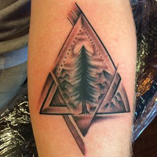 Landscape that in a triangle by Demian Bouchan at Southern Star Tattoo in Atlanta, Georgia