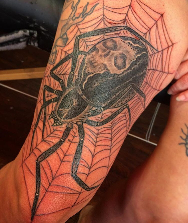 Black widow tattoo by Demian Bouchan at Southern Star Tattoo in Atlanta, Georgia