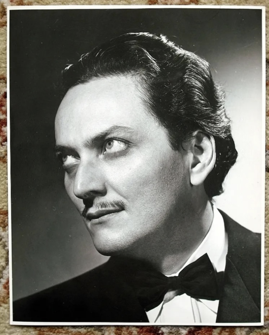 A black-and-white portrait of Manly P. Hall
