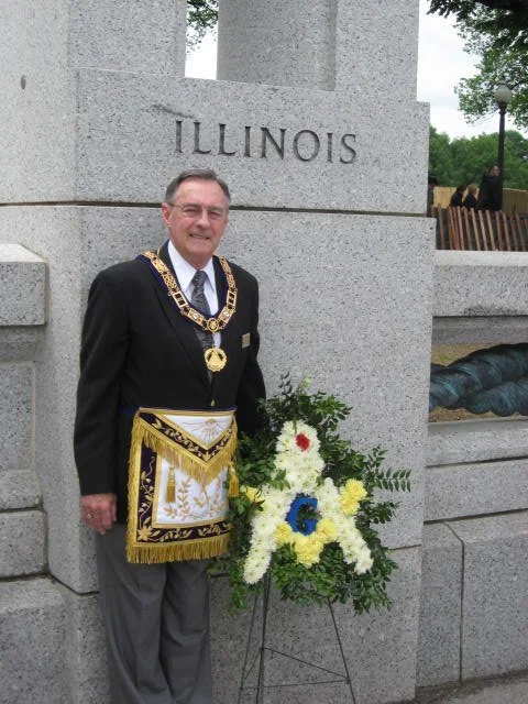 Past Grand Master Yandel in Masonic regalia at a WWII Memorial