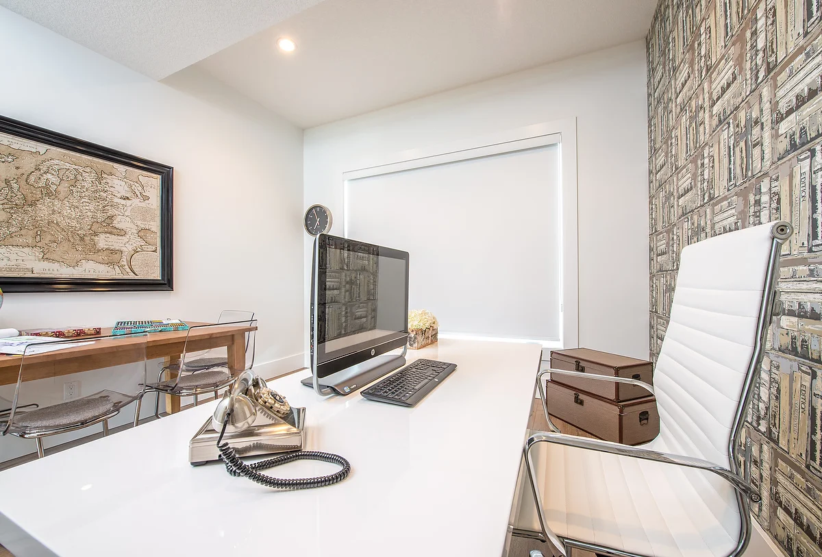 The office strikes the perfect balance of old world style with modern forms.
