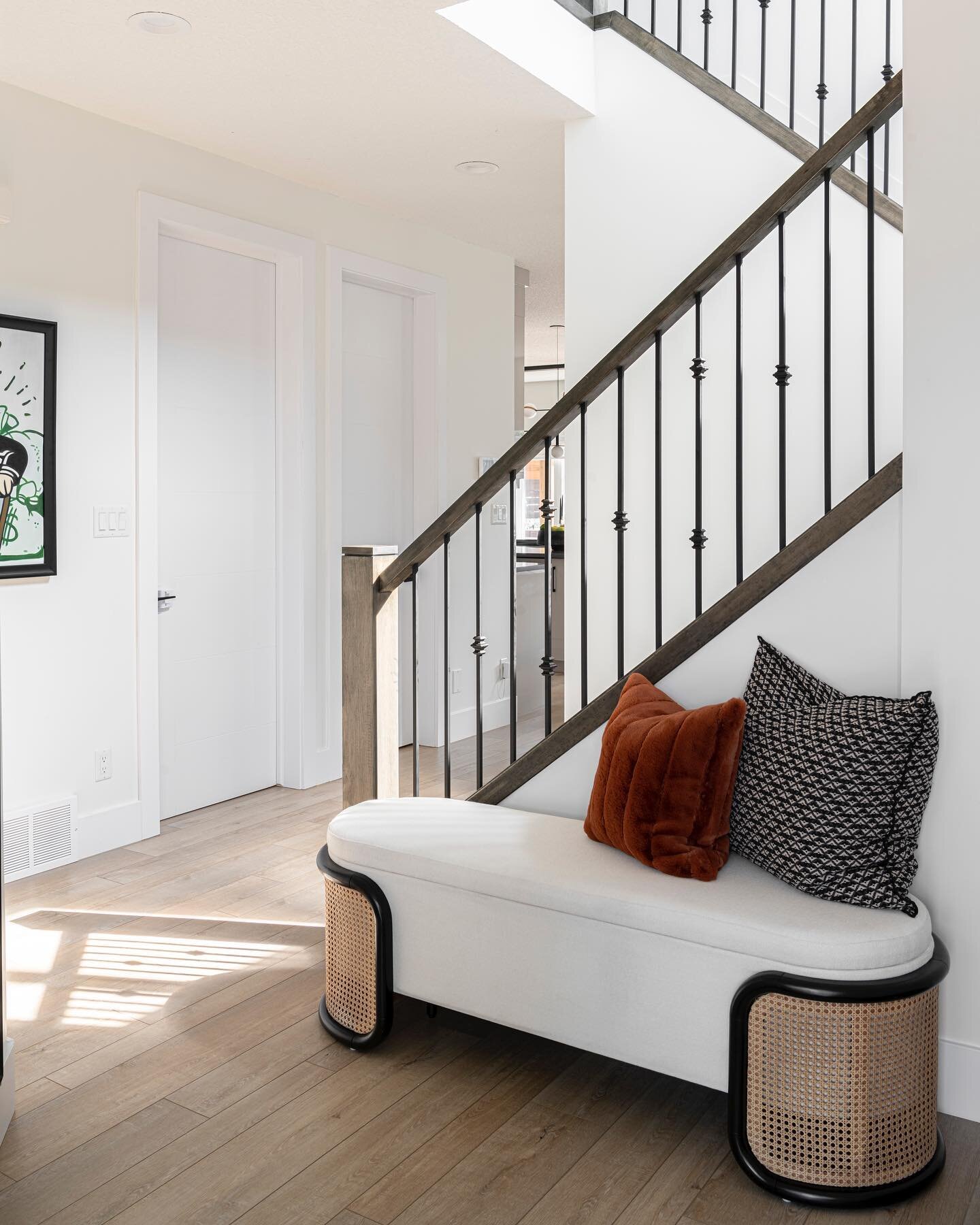 Simple details that gave this foyer a new vibe. 
We made simple changes that not only made the space feel more light and airy, but made it a bit more functional.  We love the details on this storage bench.  Mirrors are so awesome to have at an entran