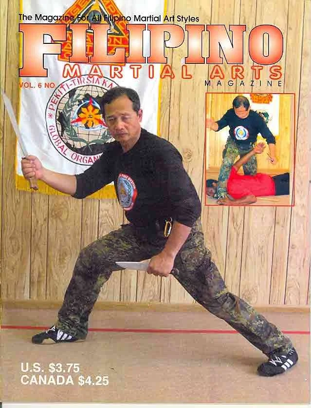 Grand Tuhon Leo T. Gaje Jr. on the cover of Filipino Martial Arts Magazine with Tuhon AK, 2004.