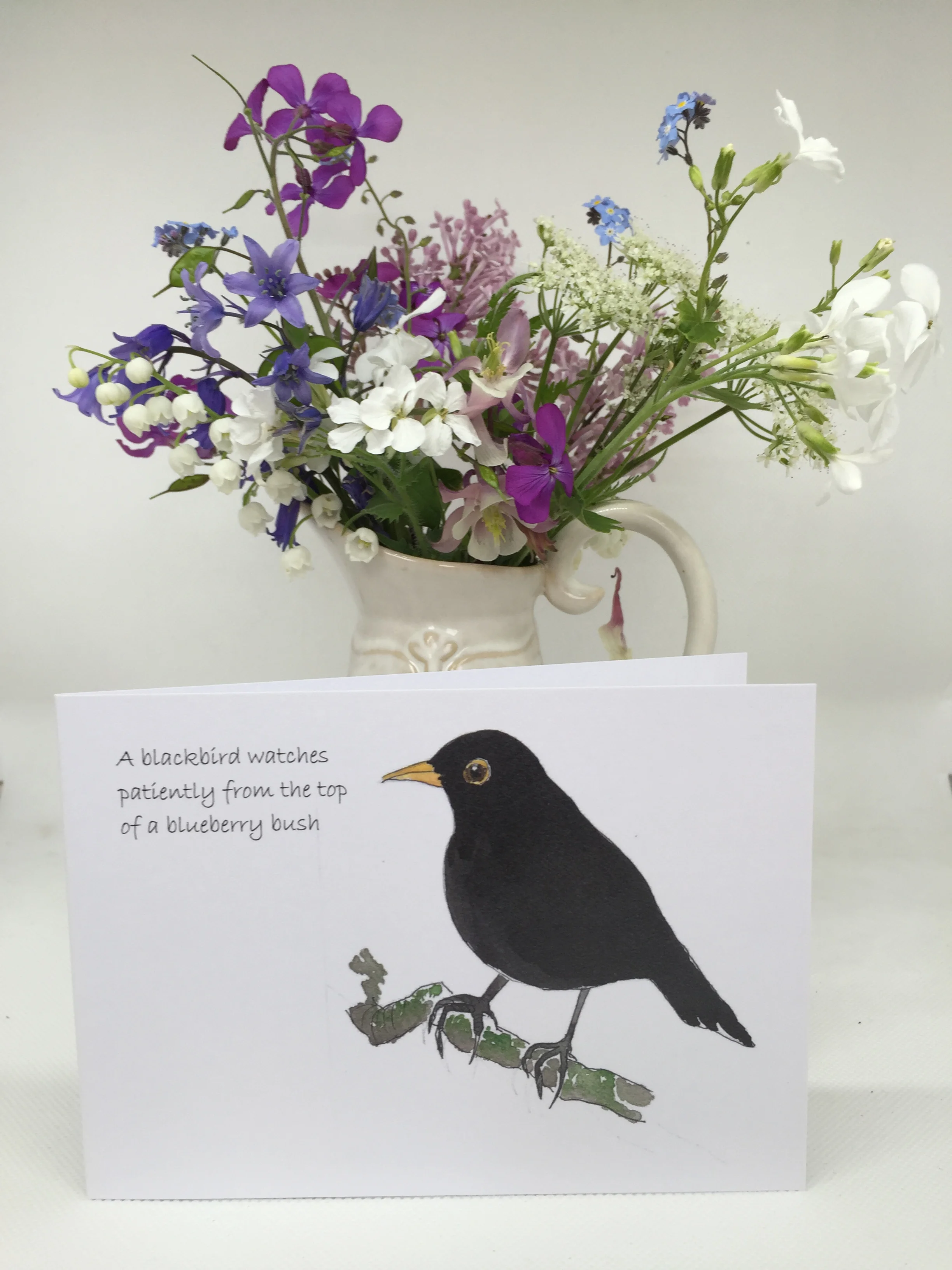 Blackbird with flowers