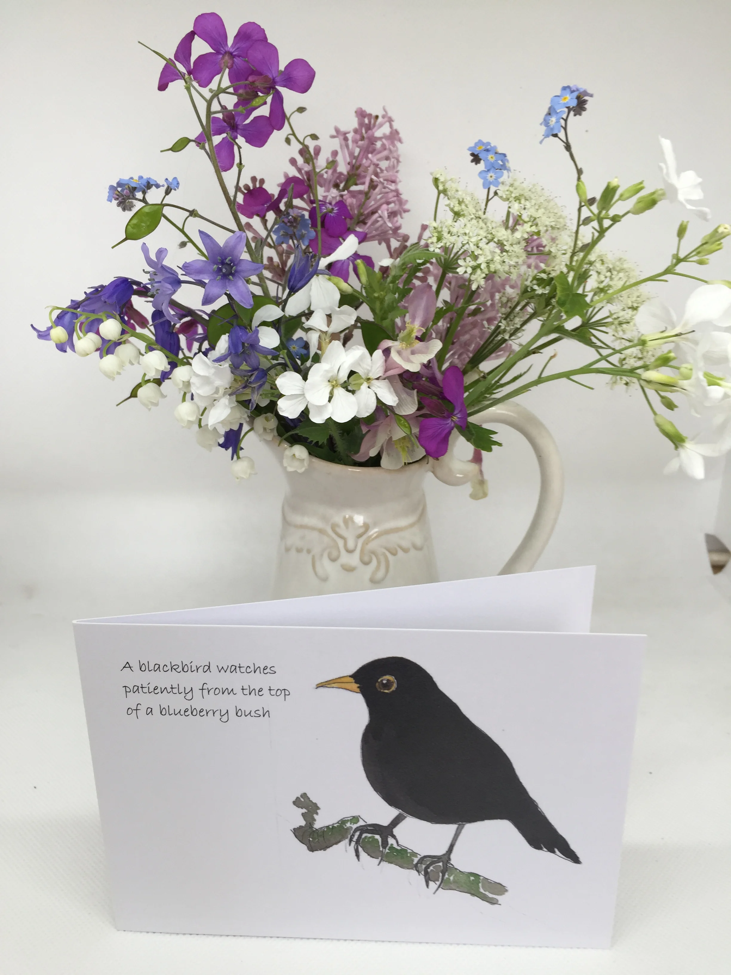 Blackbird with flowers