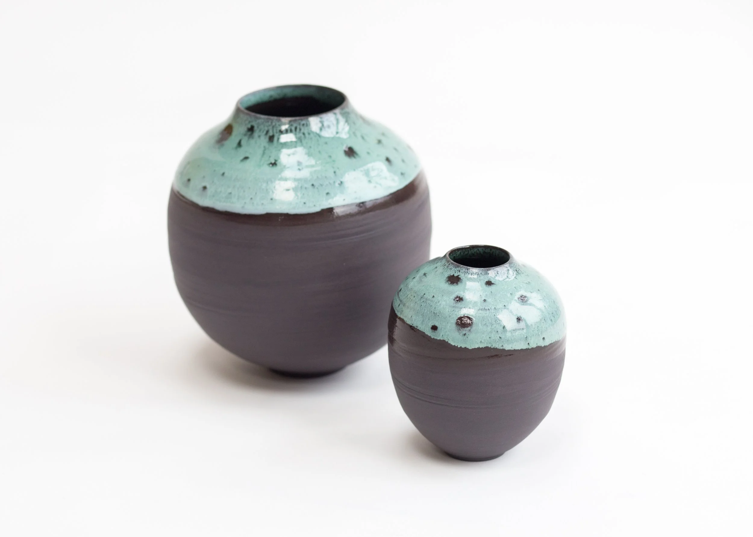 Medium onyx black porcelain moon jar with light copper green (limited