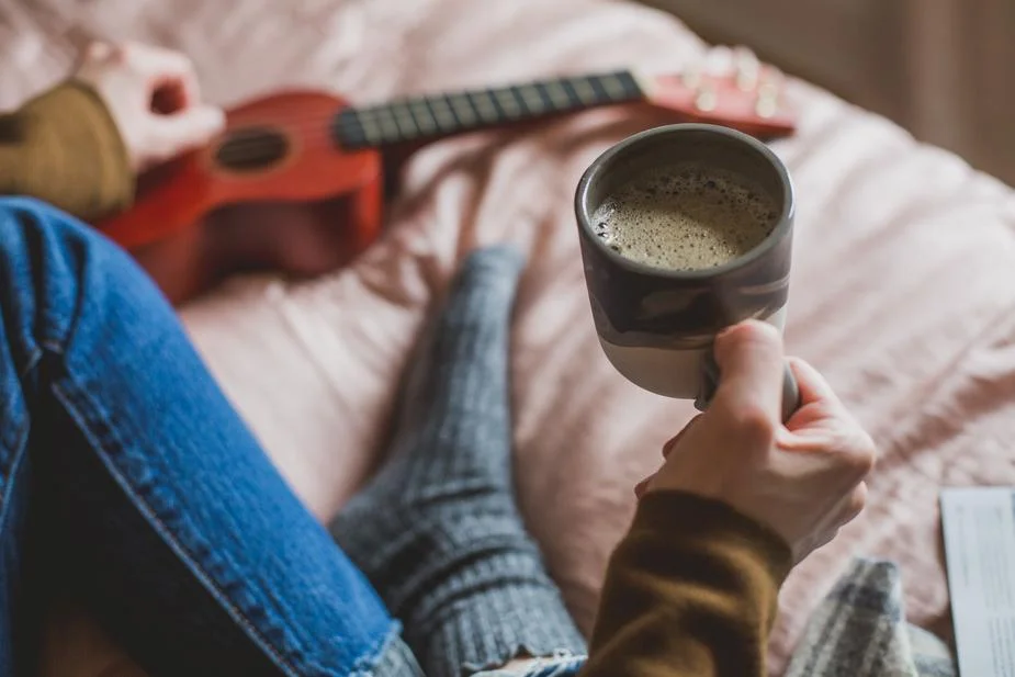 holding-coffee-in-bed_925x (1).jpg