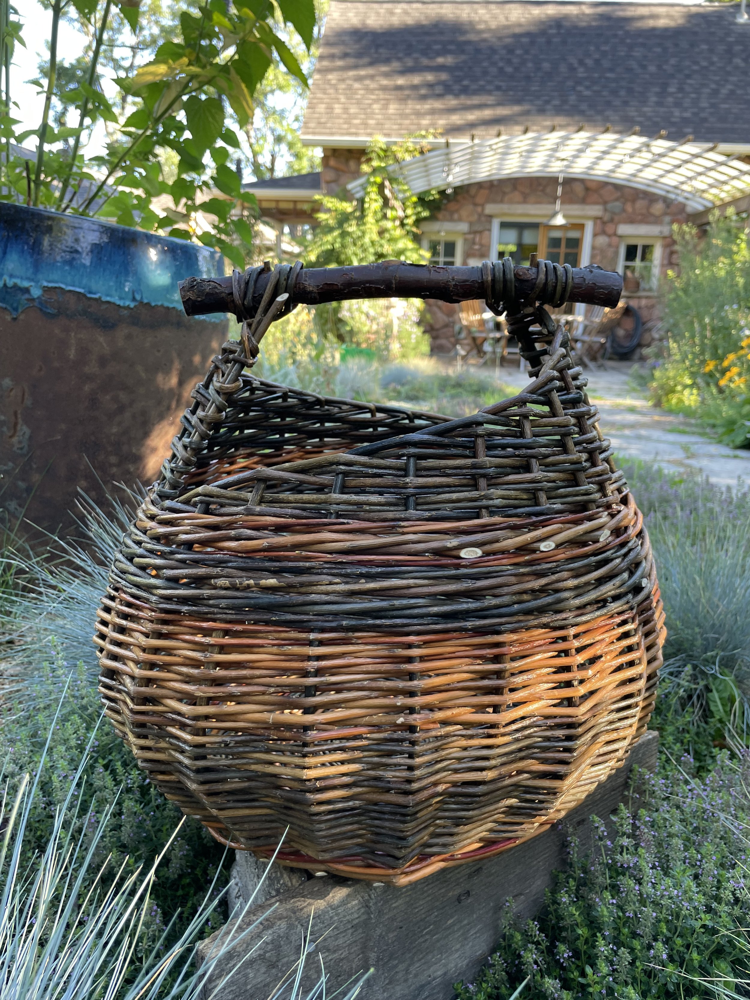 Asymmetrical willow basket with cherry handle