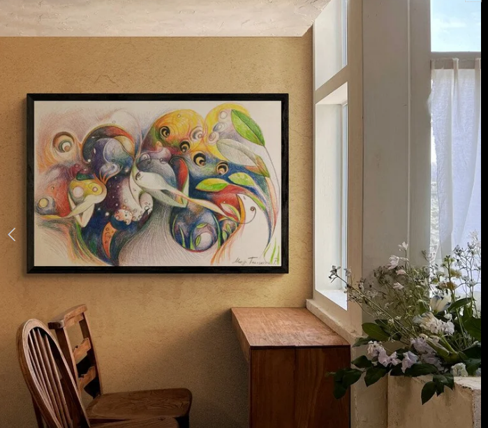 A colorful drawing hanging over a table