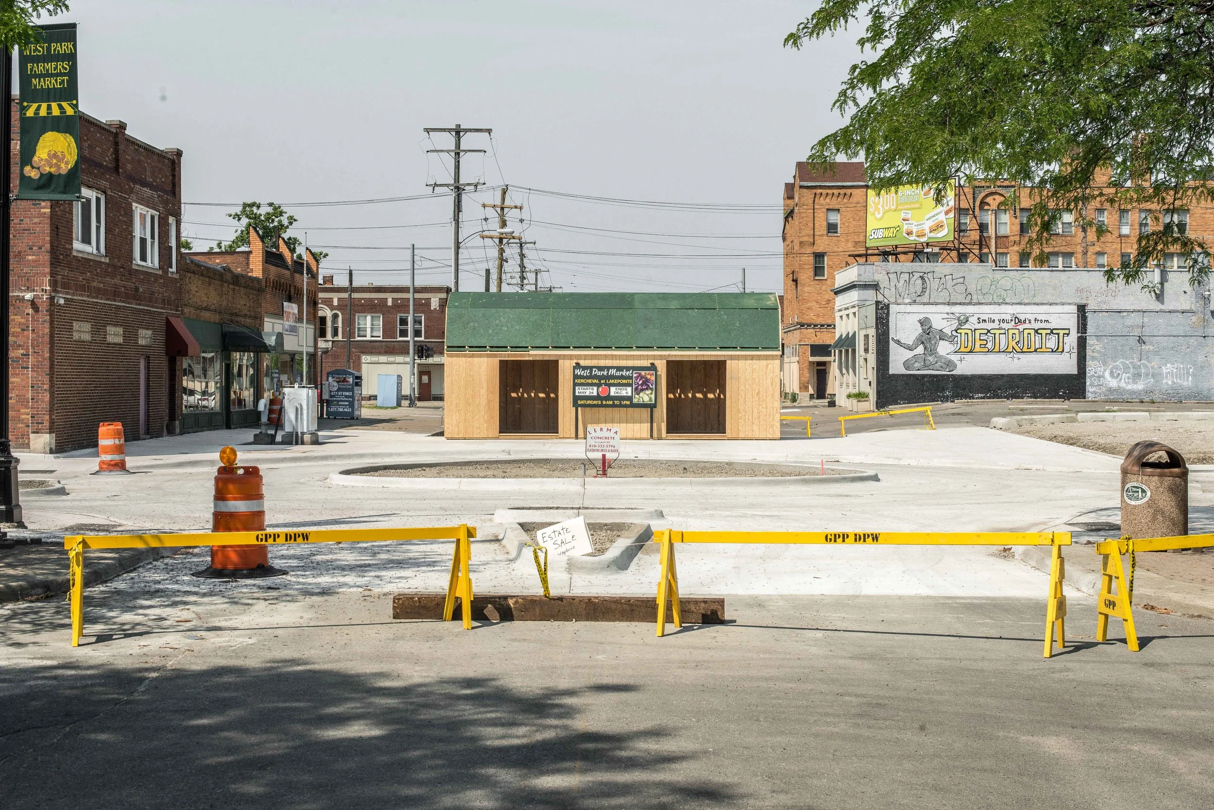  Kercheval roundabout and street closed off with farmers market shed. 