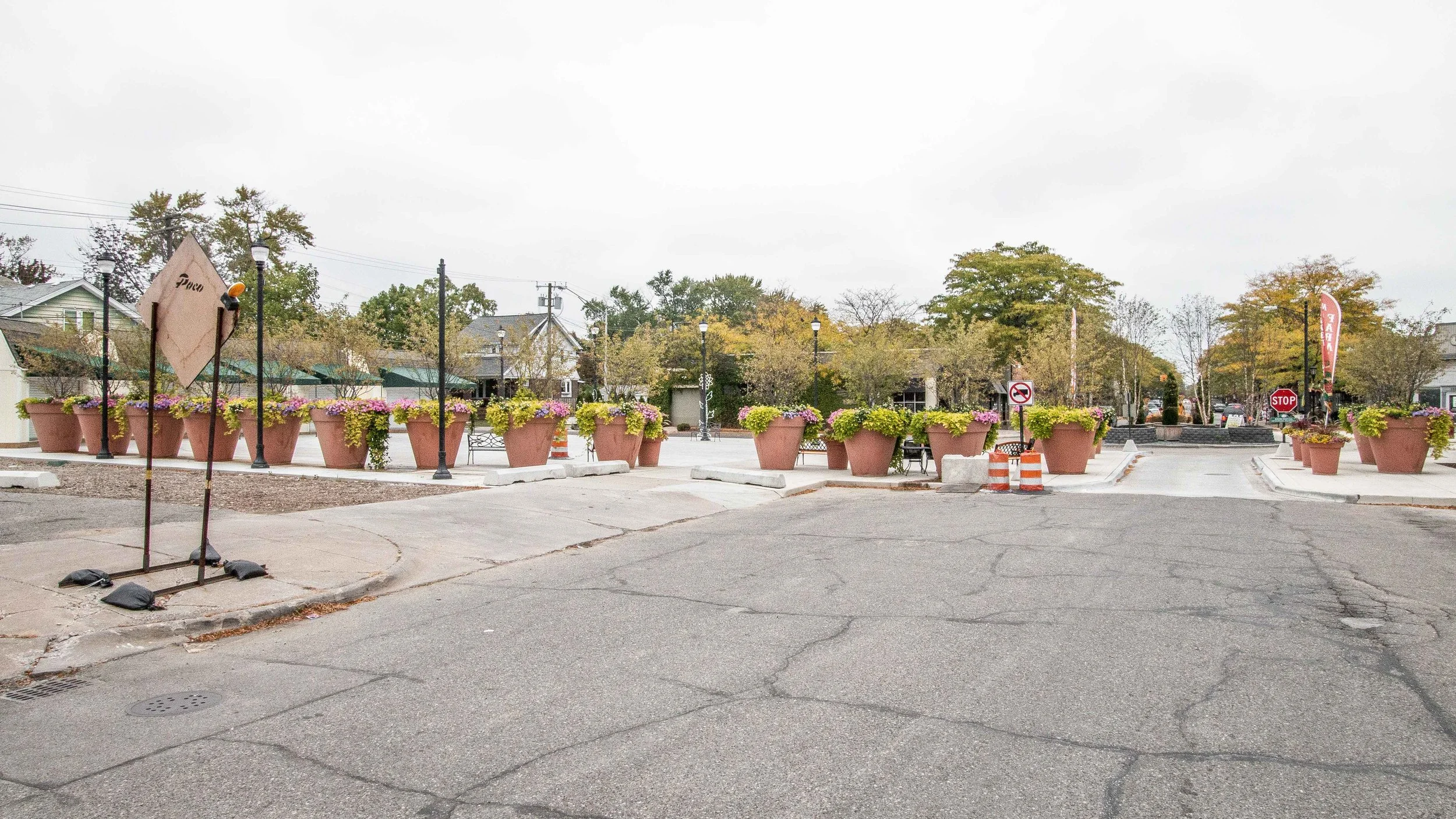  Detroit side of Kercheval roundabout. The shed was removed and replaced with these large planters designating border. 