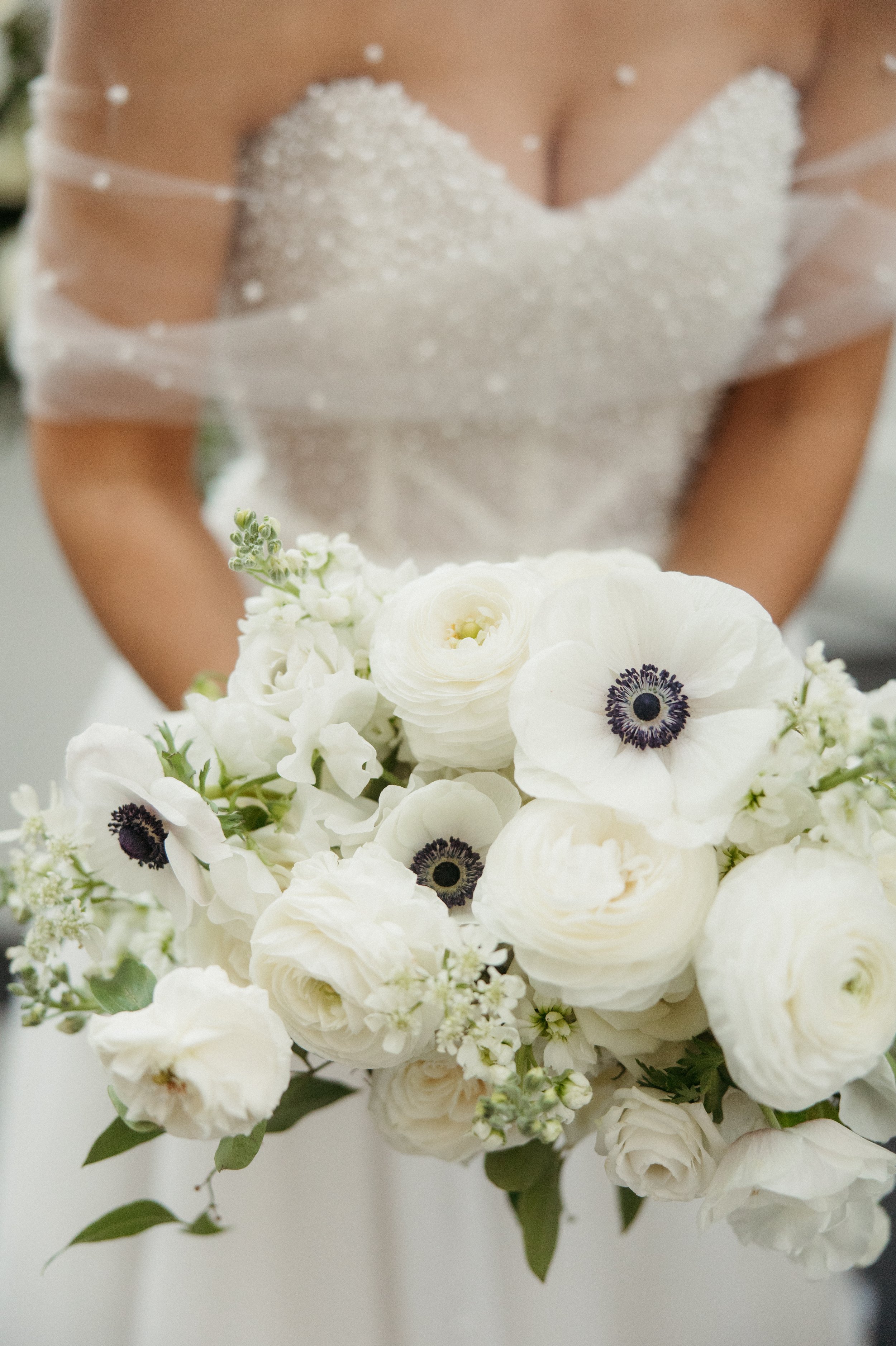 Close up of modern romantic white bridal bouquet by Pittsburgh wedding florist.