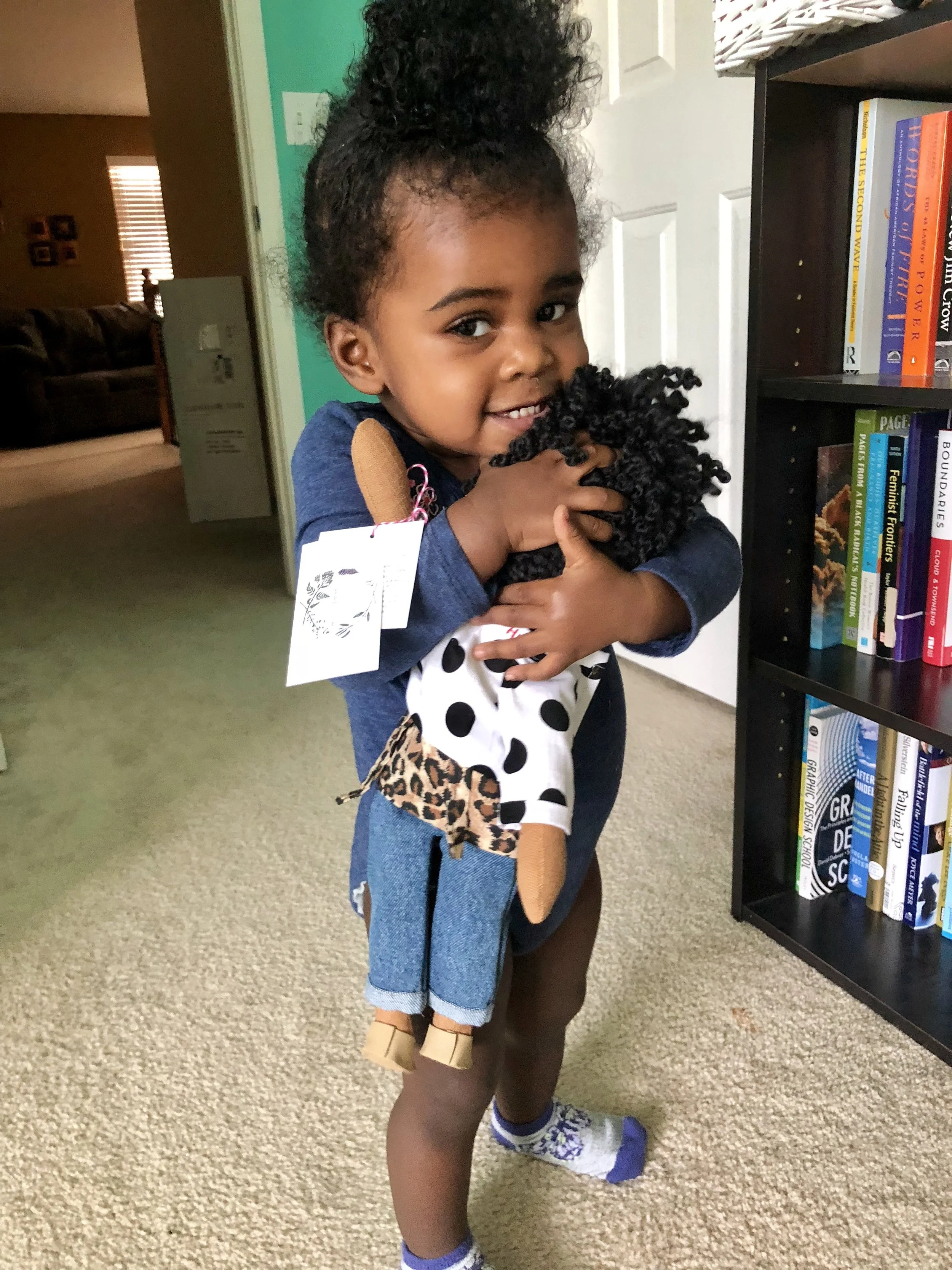 Zion and her Harper Iman doll