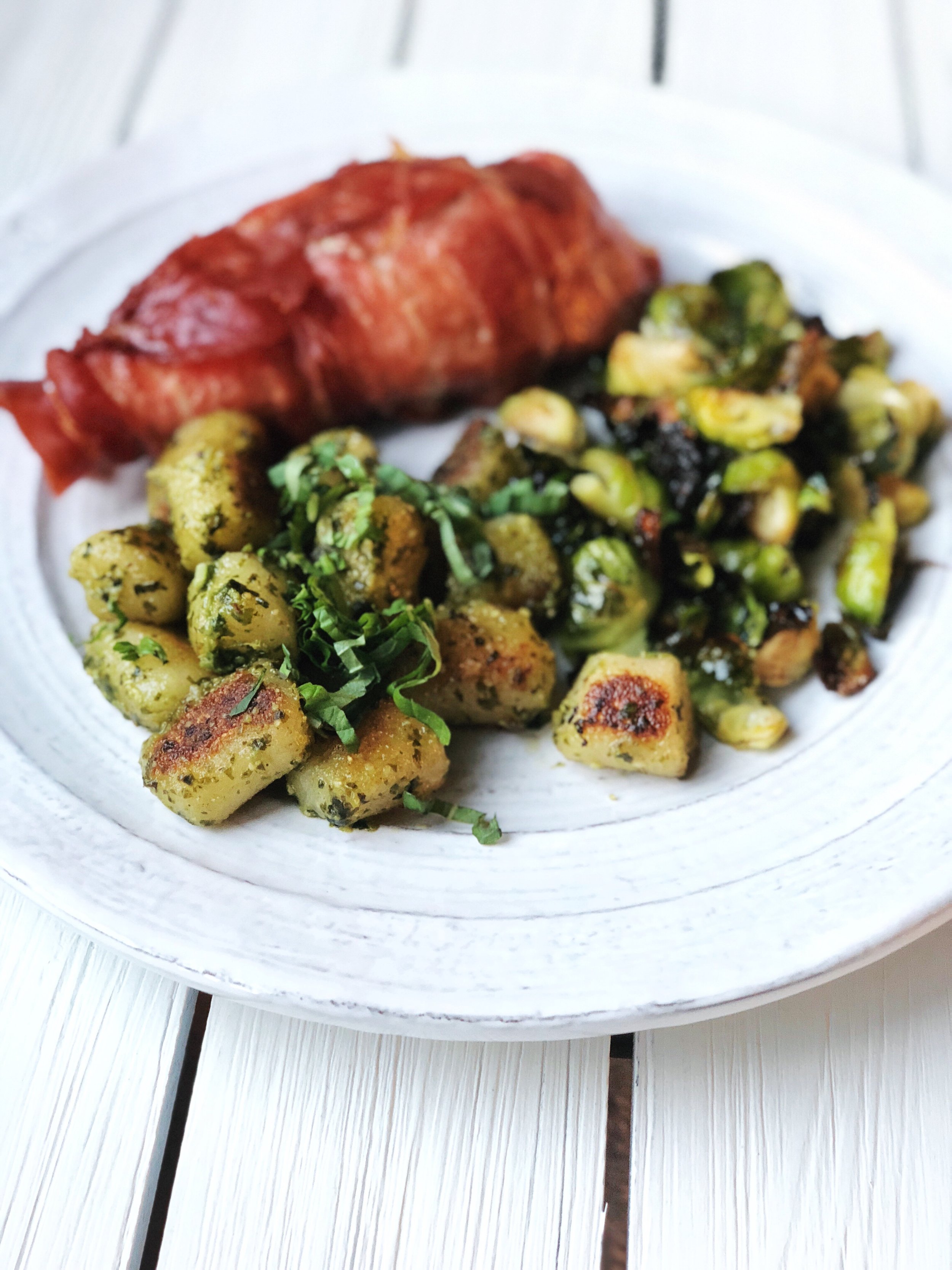 Prosciutto Wrapped Chicken with Balsamic Brussels & Pesto Cauliflower Gnocchi