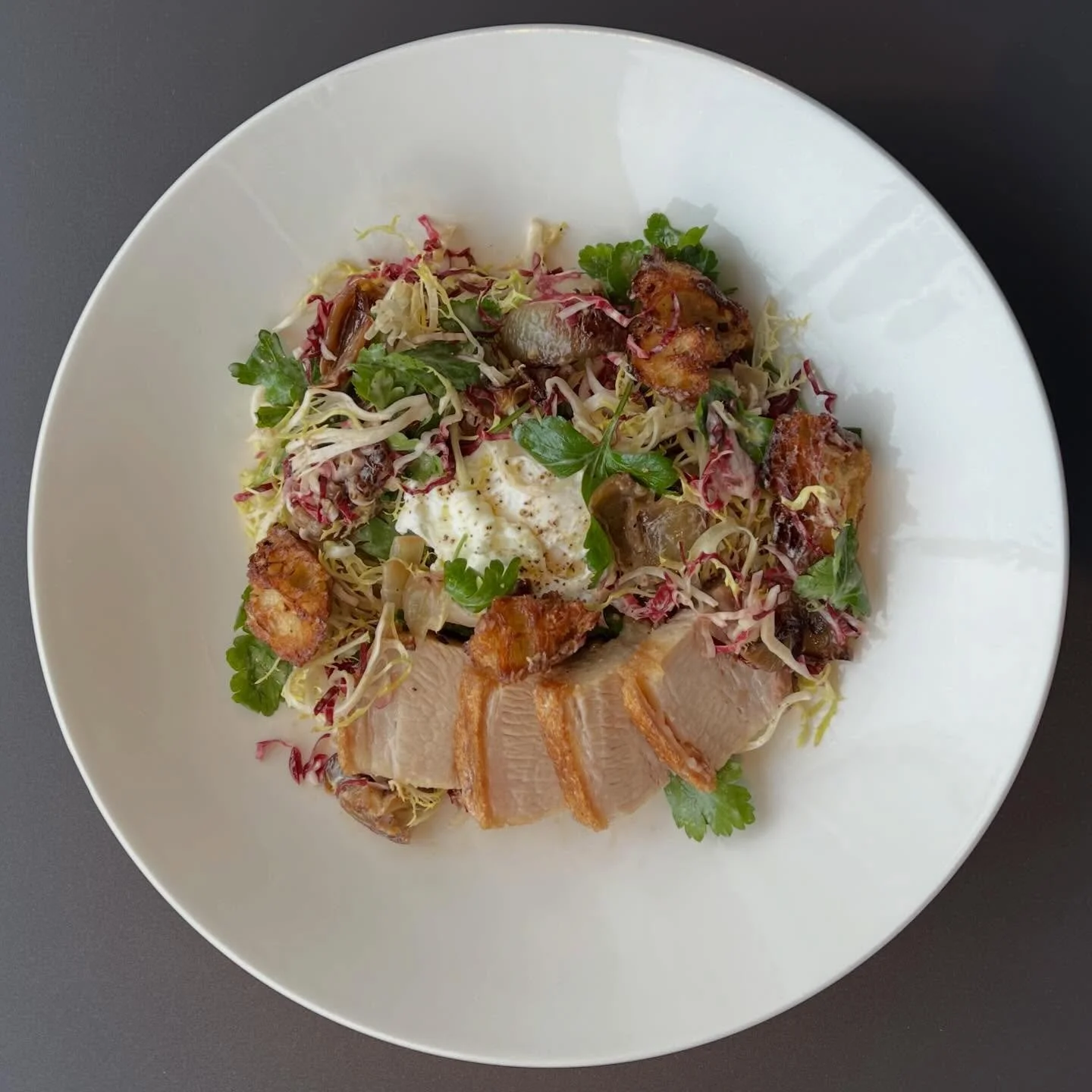 Lunchtime at 1900 ⭐️⭐️⭐️⭐️⭐️

Salade Lyonnaise with Craquelin Roast Pork Belly &bull; dijon-banyuls vinaigrette, fris&eacute;e, toasted baguette croutons, poached egg, shallot confit

Tempura Fried Chicken Sandwich &bull; rosemary a&iuml;oli, avocado