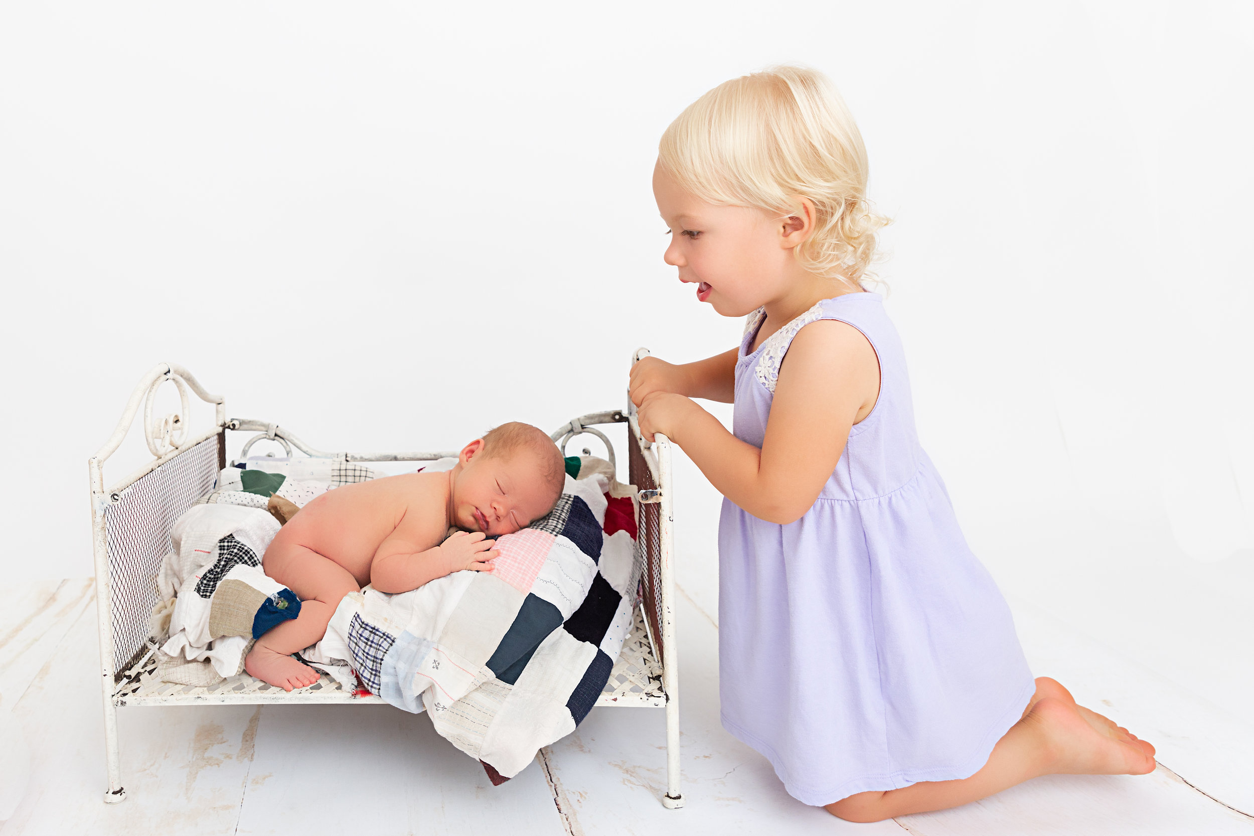 newborn baby and big sister