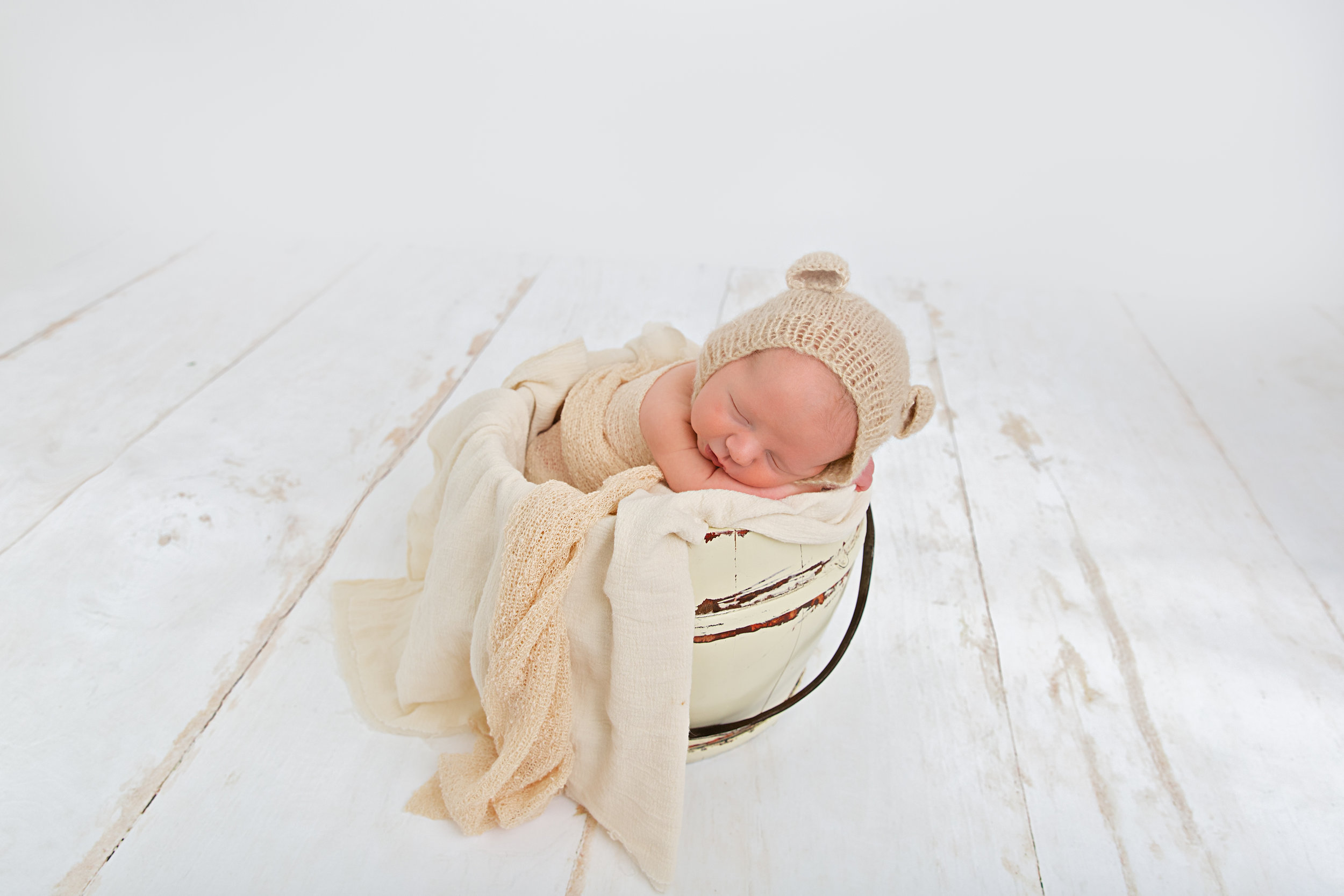 newborn baby in prop pose