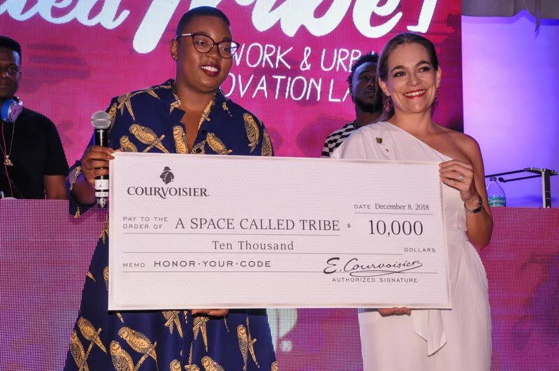 Felicia Hatcher-Pearson accepting Courvoisier’s donation at In Honor of Your City Miami December 8, 2018.