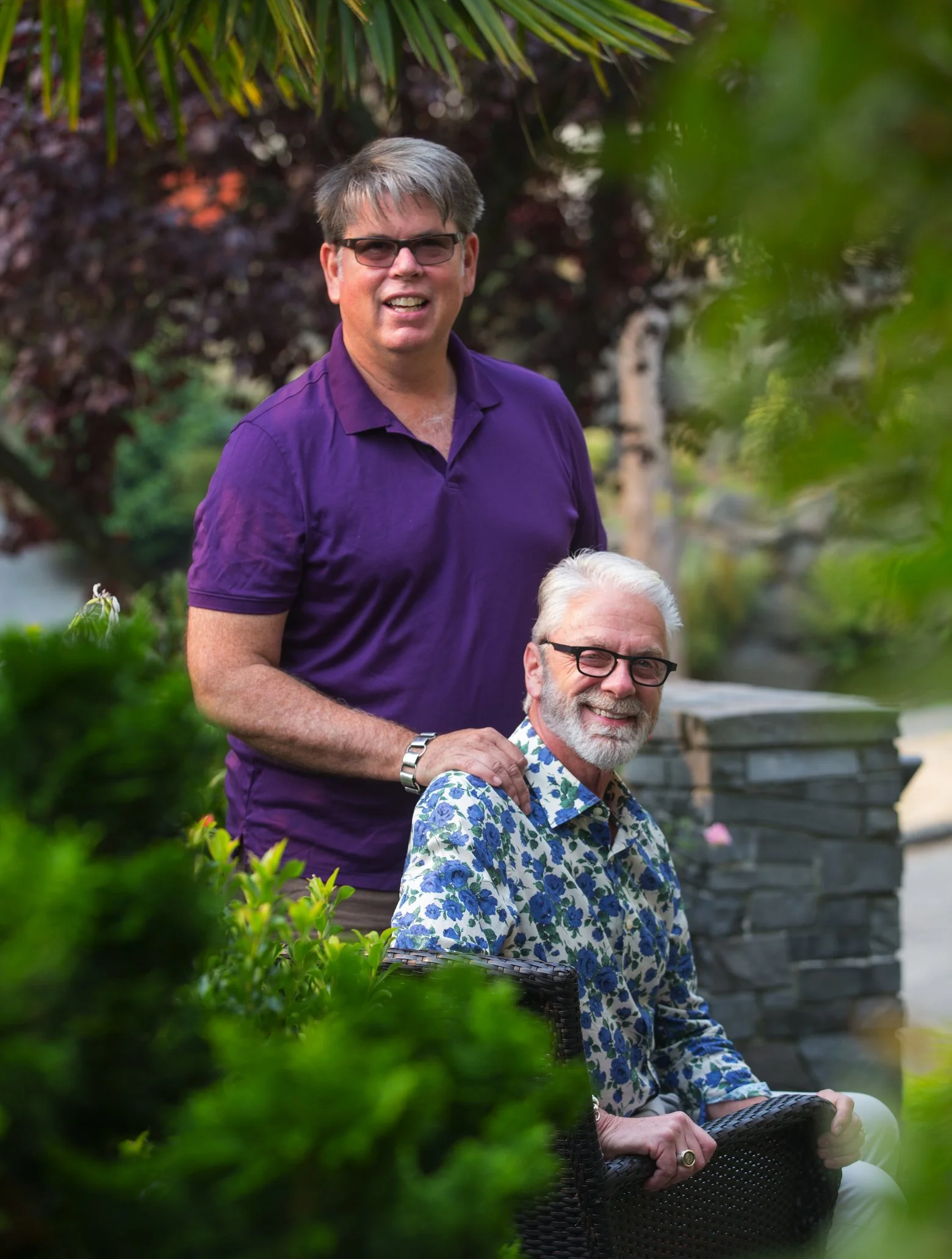 Daniel Lowery, left, and Carl Williams in their West Seattle garden. (Mike Siegel / The Seattle Times)