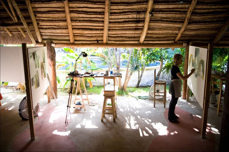 Painting in an open air palapa in the Yucatan, Mexico. Photo by Ali Goodwin