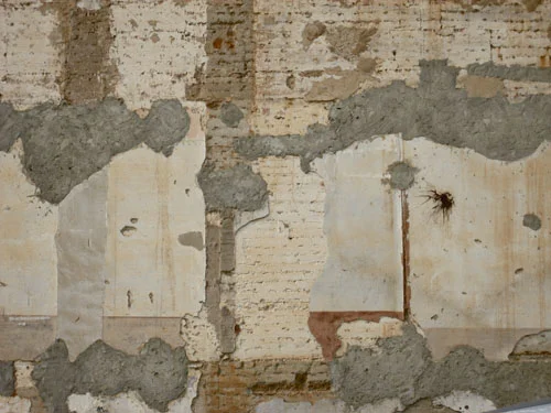 Collbato, Spain - textured wall - pocked and splatted.