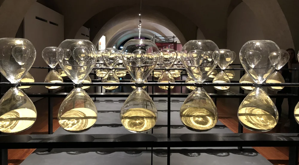 Installation of slowly rotating hour glasses at Somerset House Design Biennale, London