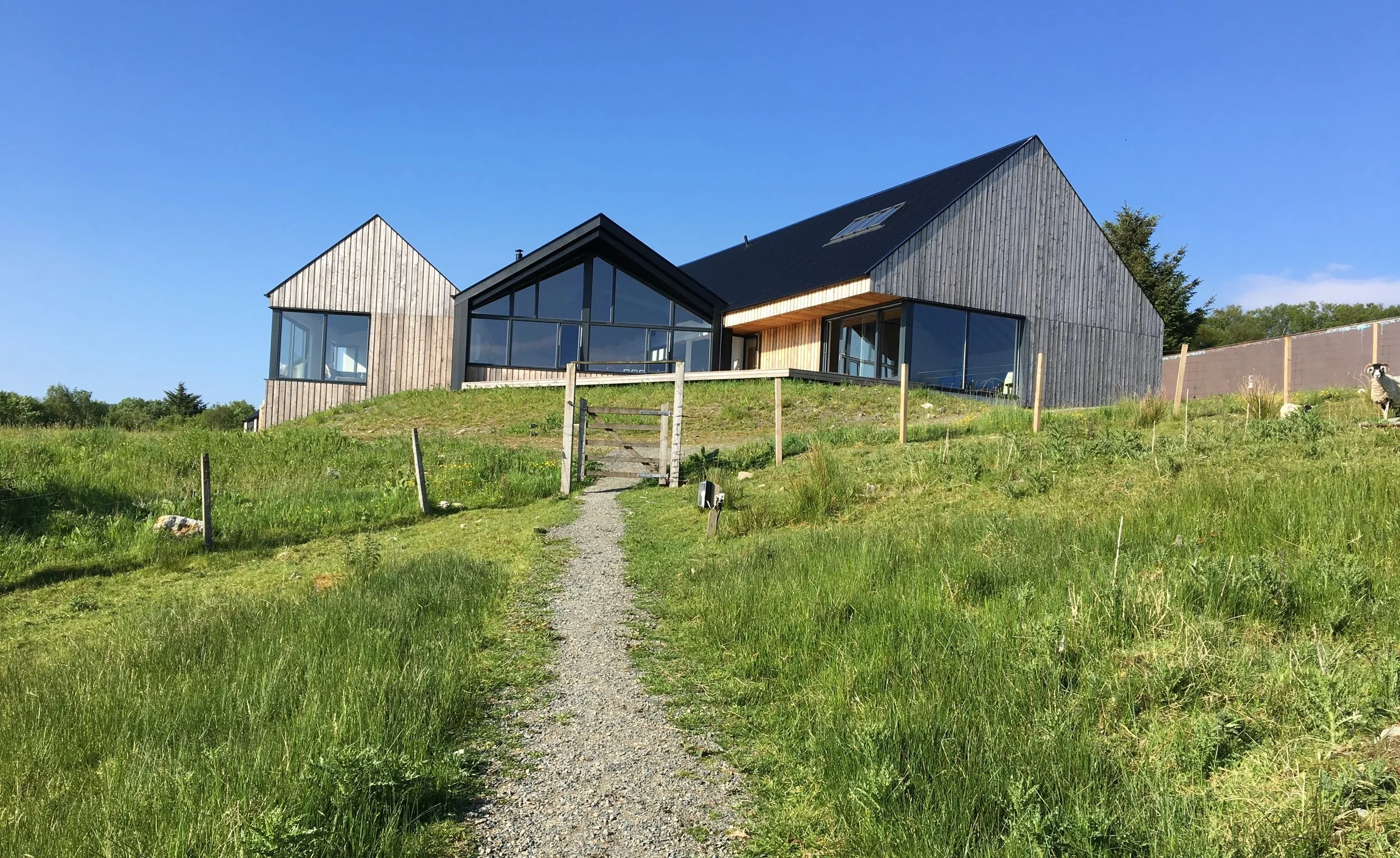A view of the Artist’s Center on a sunny day, up the path from the Pods and Cubes.
