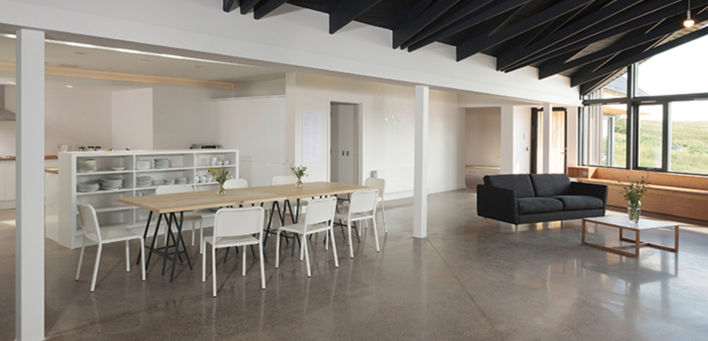 The interior of the Artist’s Center open plan living room, dining room and kitchen.