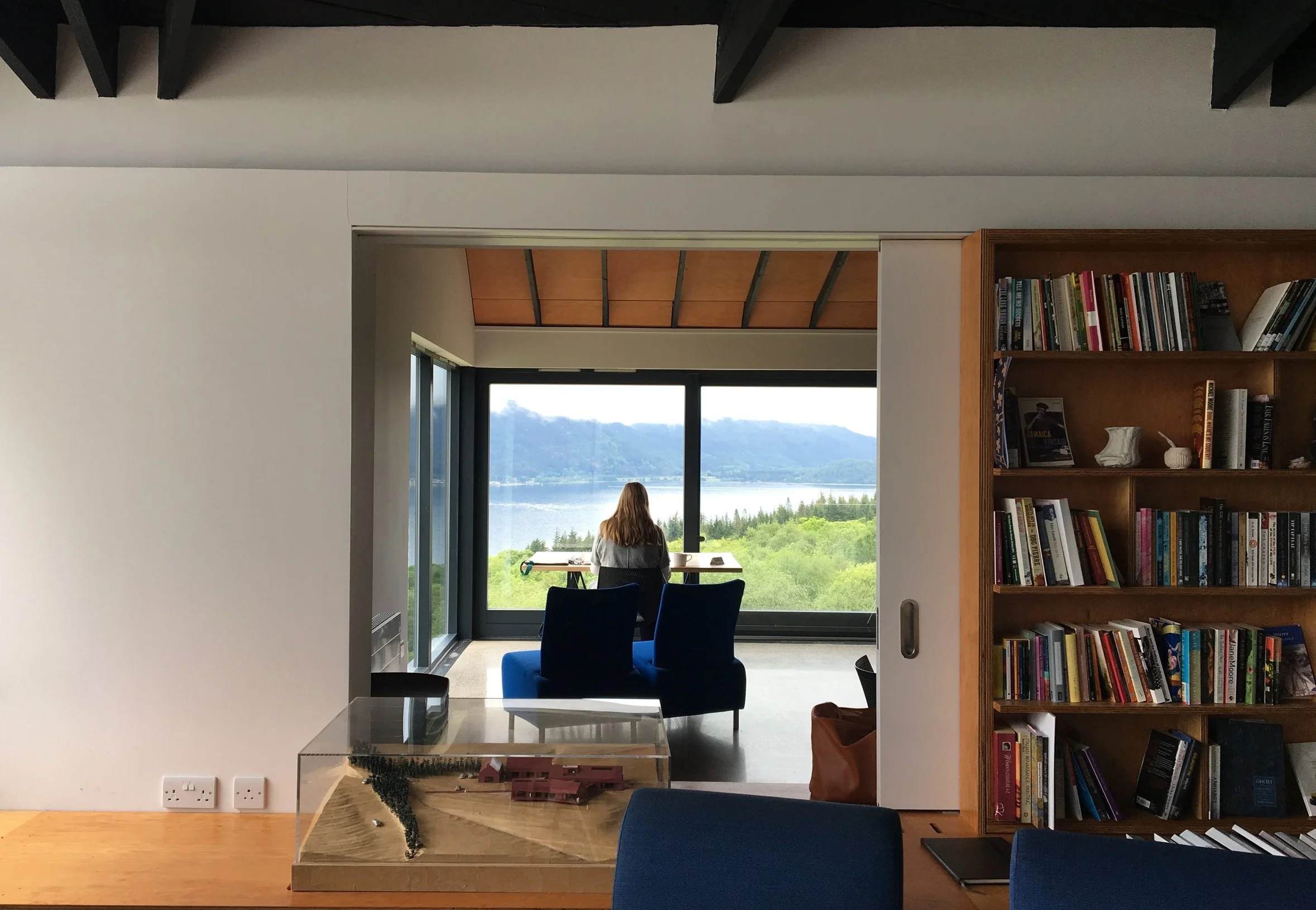 Looking through the Artist’s Center meeting room to a writer’s station overlooking the Loch.