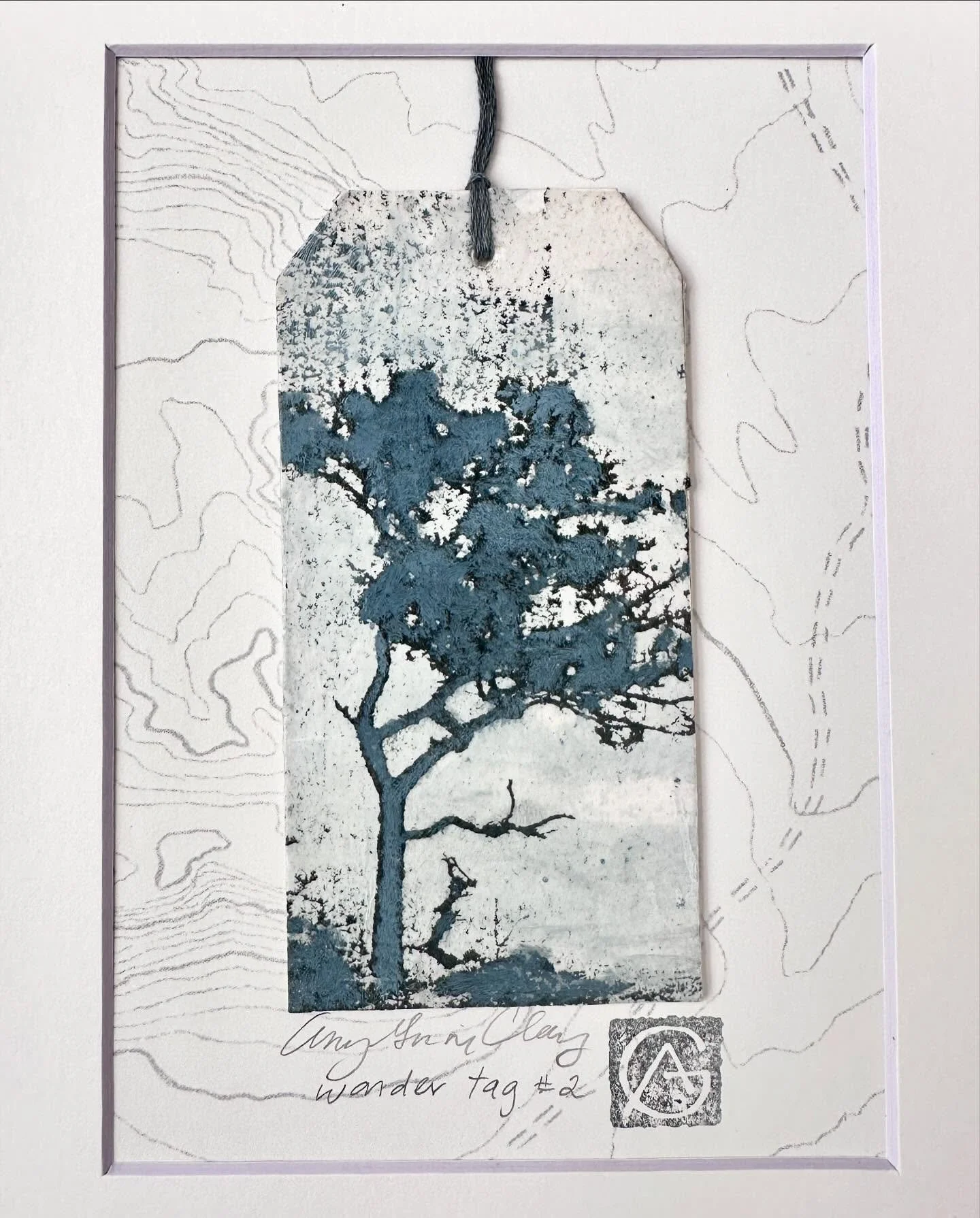 I&rsquo;ve been exploring ways to present my Wander Tags from my residency in Wales this past February. Here&rsquo;s one of the options, mounted on a drawn topo map, stamped and framed. (The stamp is a mashup mark of my initials).
Come by Open Studio