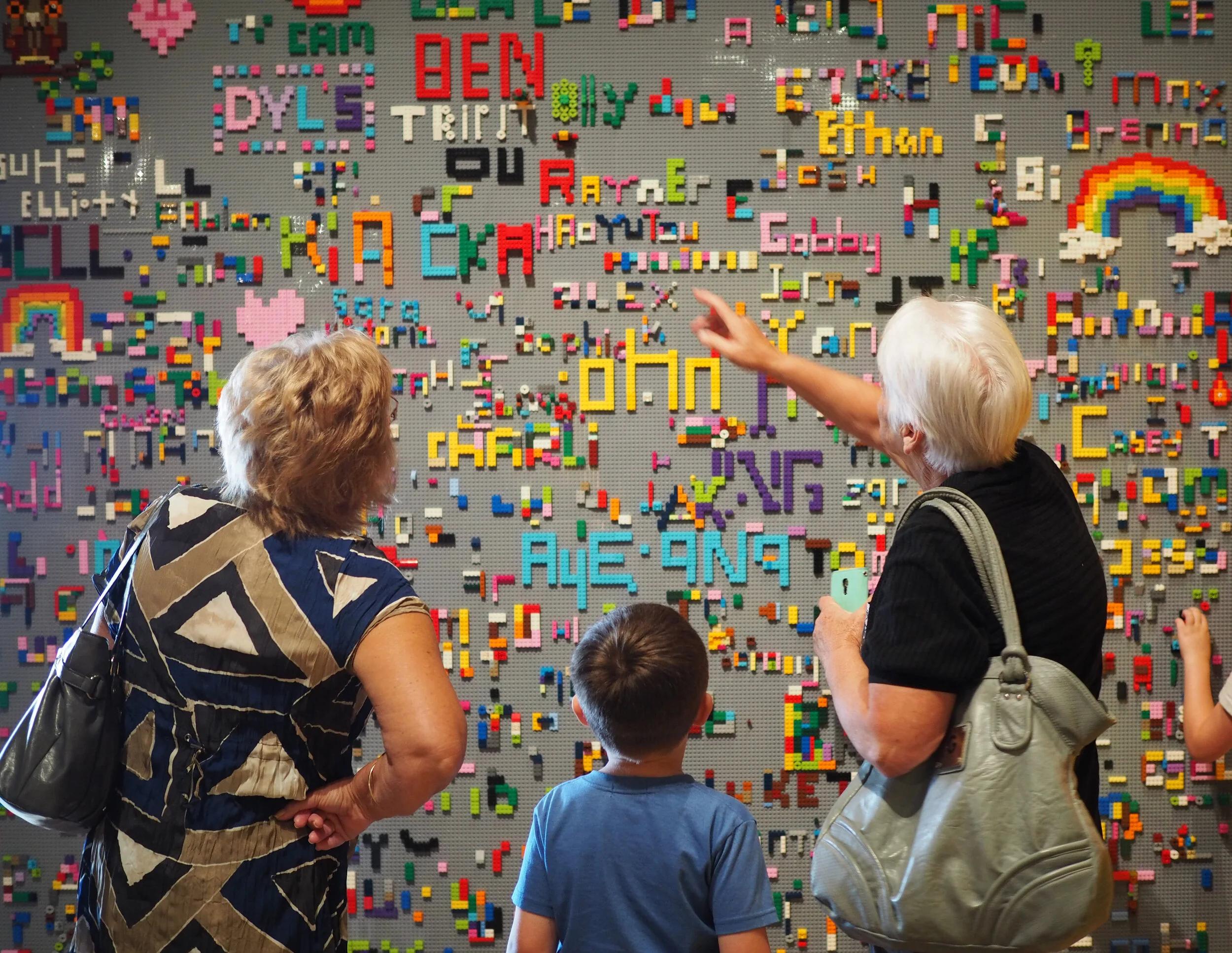 At the Signature Wall for the Brick Flicks exhibitions, 2017. (Photo: Te Manawa)
