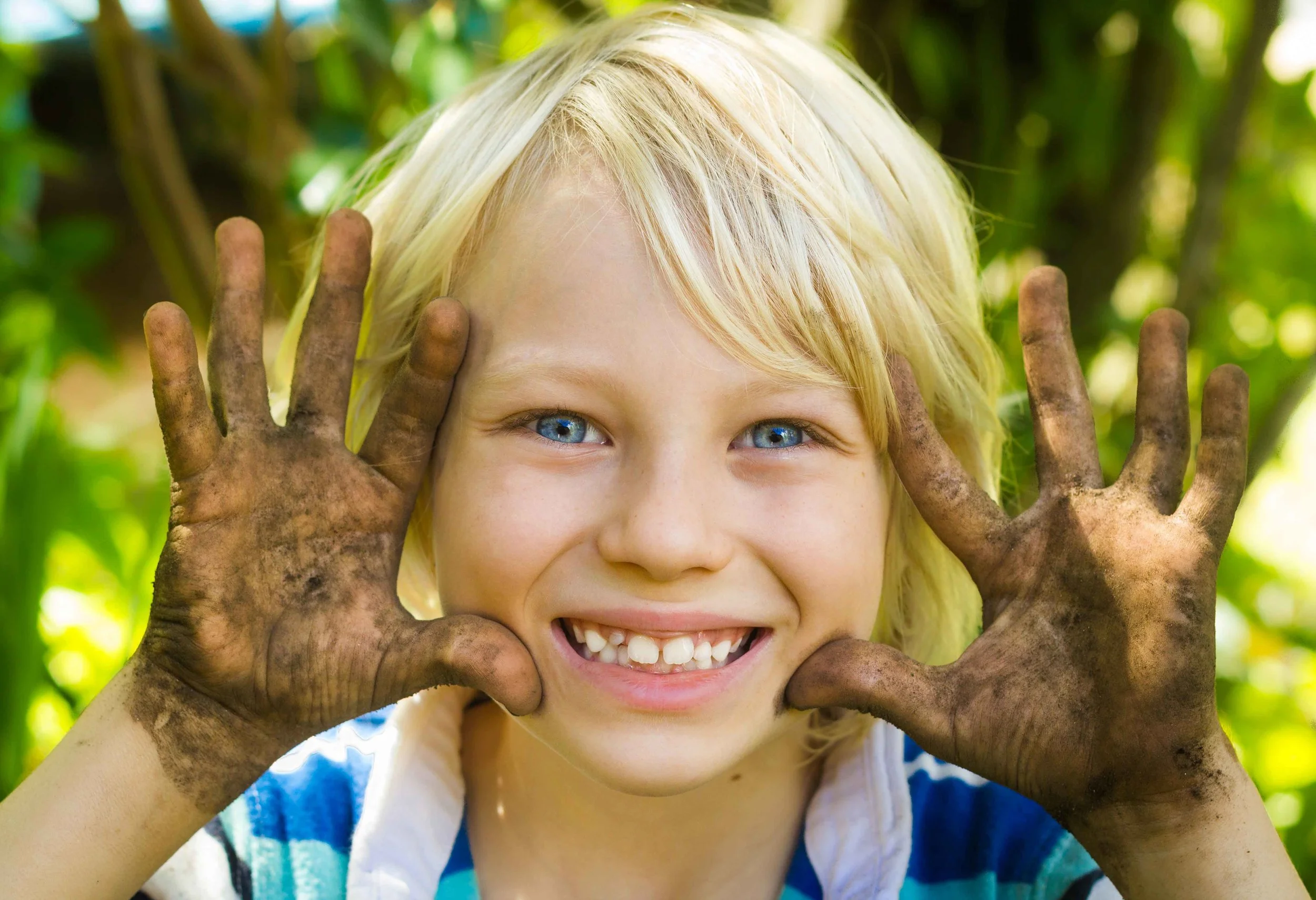 Camps-mud-smiling-kid-for-web.jpg