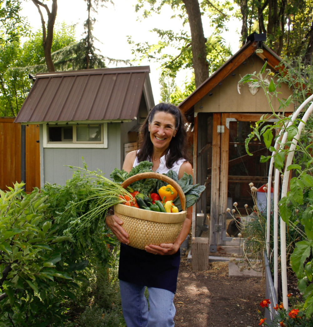 Dr. Bonnie holding fresh garden produce