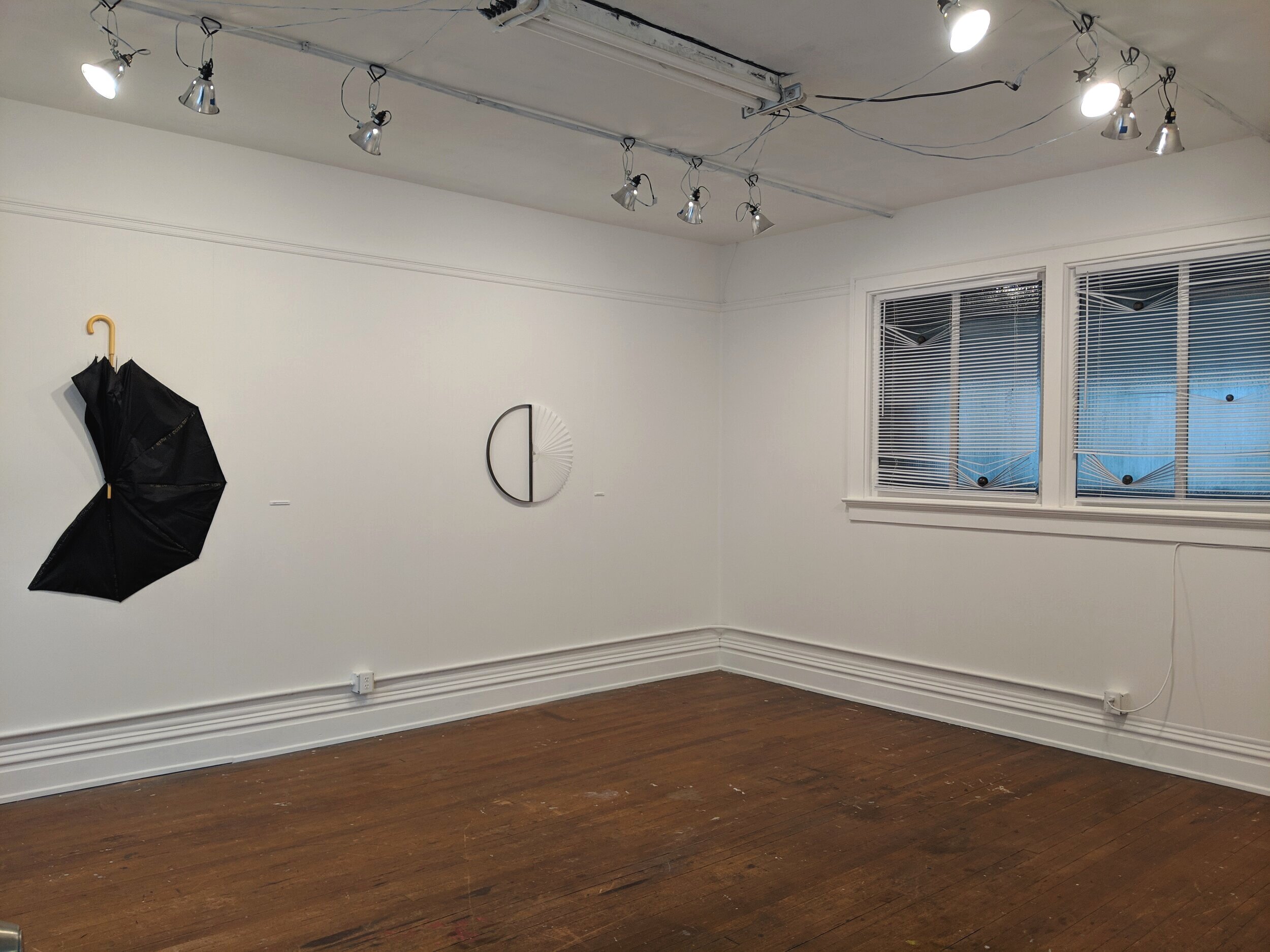  (left to right)    I promised I’d leave you out of this , umbrella. 2019;  Who are we kidding?,  pleated fabric shade, steel. 2019;  In advance of a broken heart , vinyl mini blinds, steel. 2019 