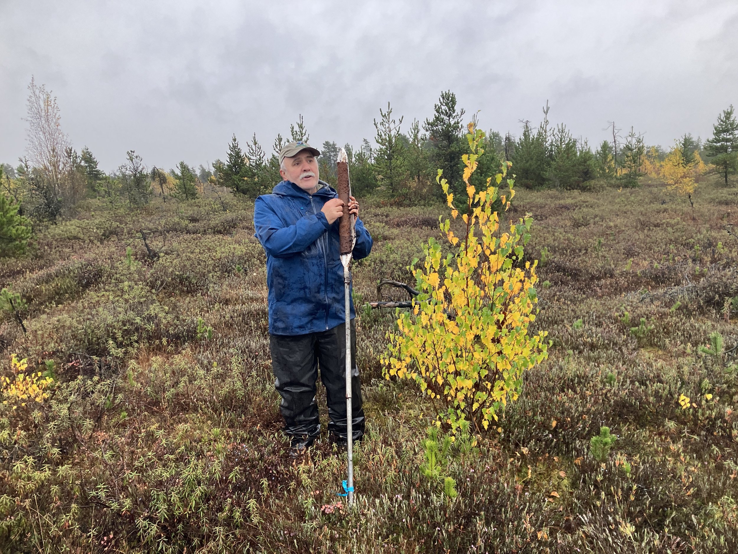  Markus Merkens with a peat auger and core sample (Adam Huggins, 2024) 