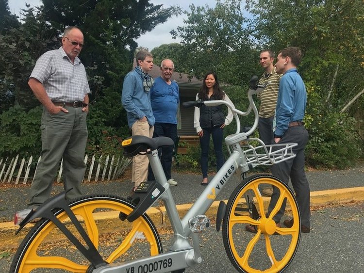 Roger and the Bicycle Committee checking out the VBikes bike share bike (2017)