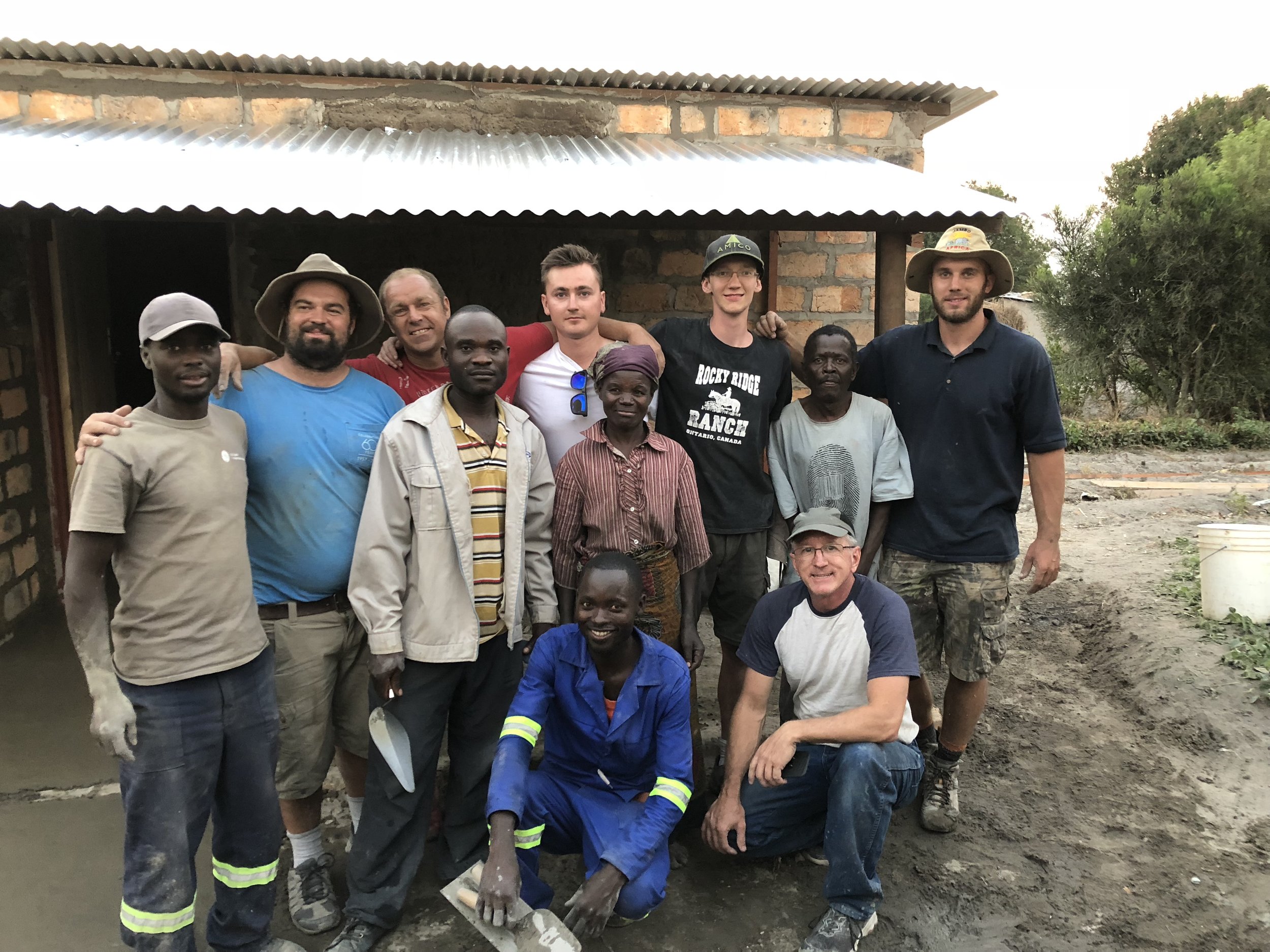 The construction team with Gift’s parents