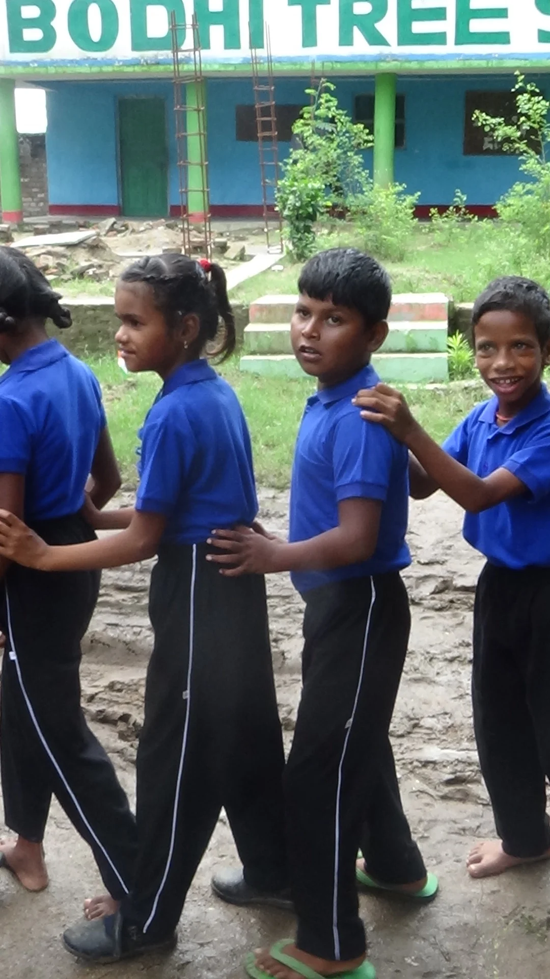 Bodhi Tree kids in tow with sign.jpg