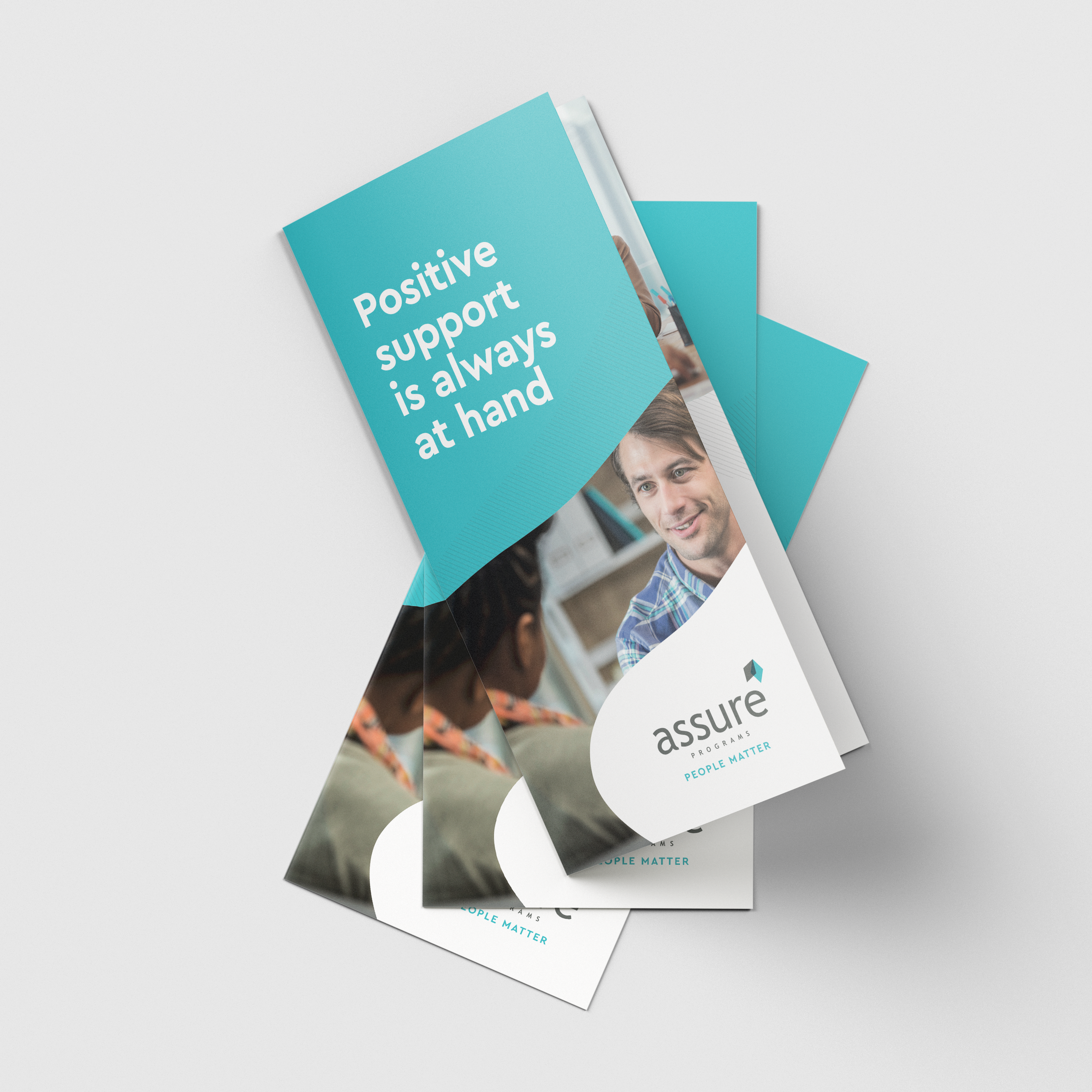 Assure_DL Brochure_Mock-Up.png