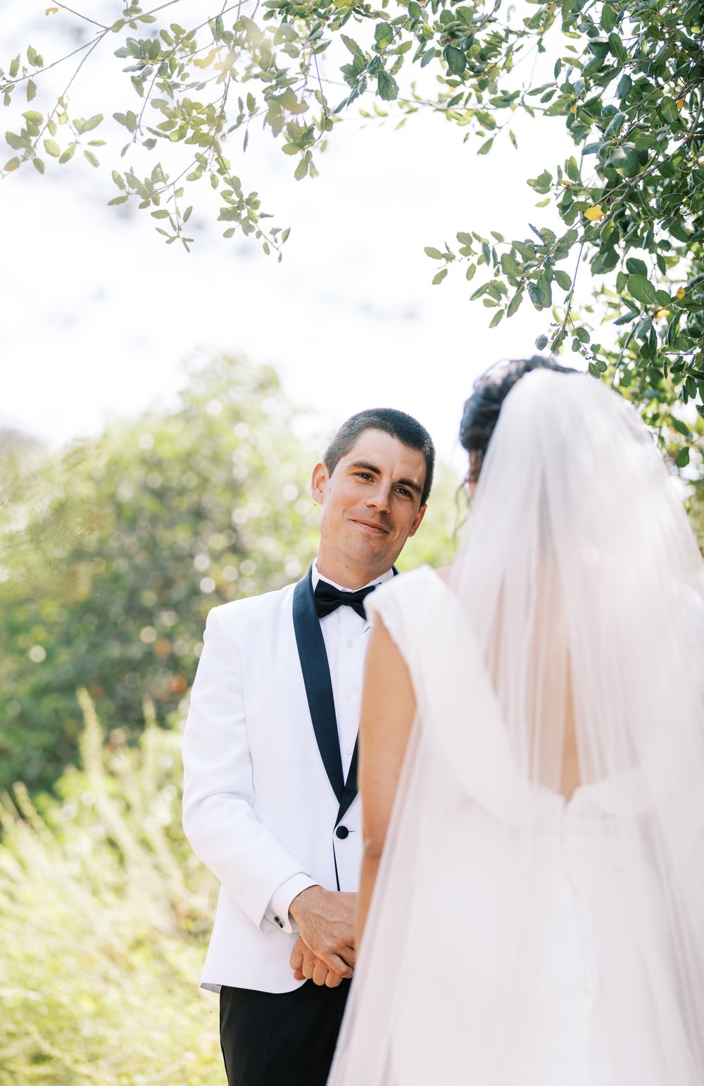 Elegant backyard wedding first look.