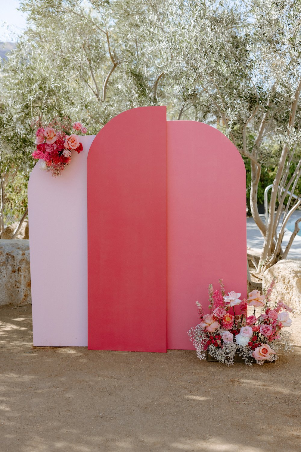 Hot pink modern wedding arch backdrop at The Ace Hotel in Palm Springs.