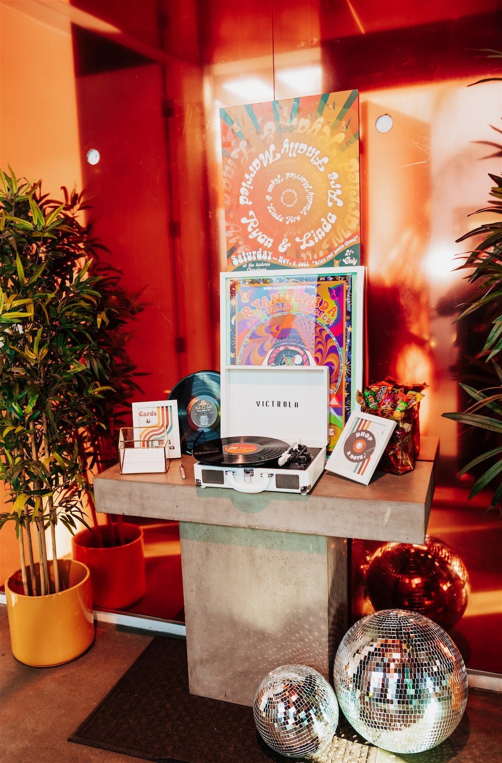 70's theme wedding welcome table at Kim Sing Theatre in Los Angeles.